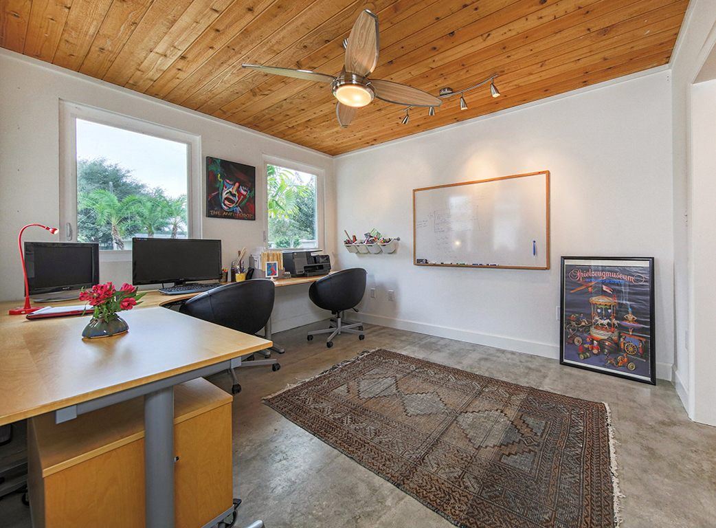 Home office under a wood ceiling