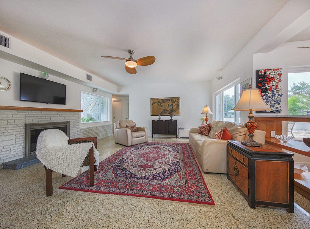 Living room with the fireplace and TV