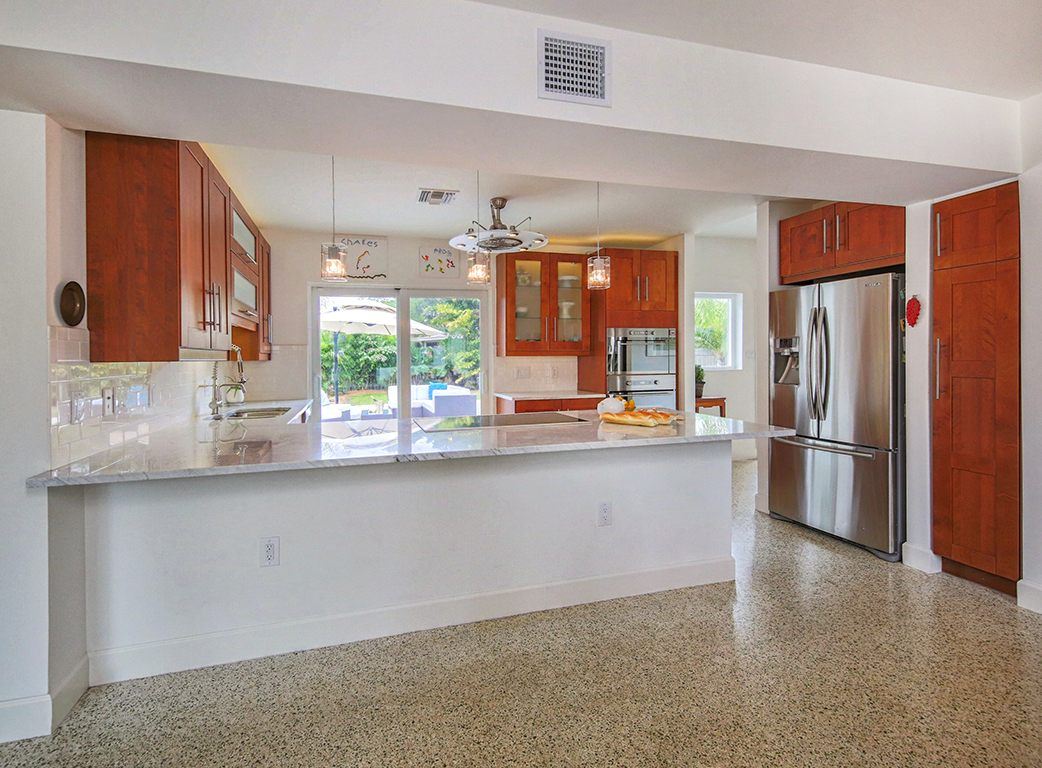 Kitchen with cherry cabinets and terrazzo floor