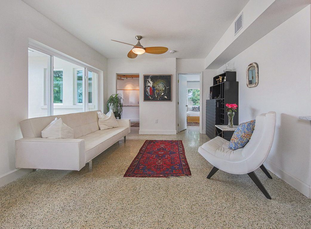Sitting area with a white sofa and lounge chair