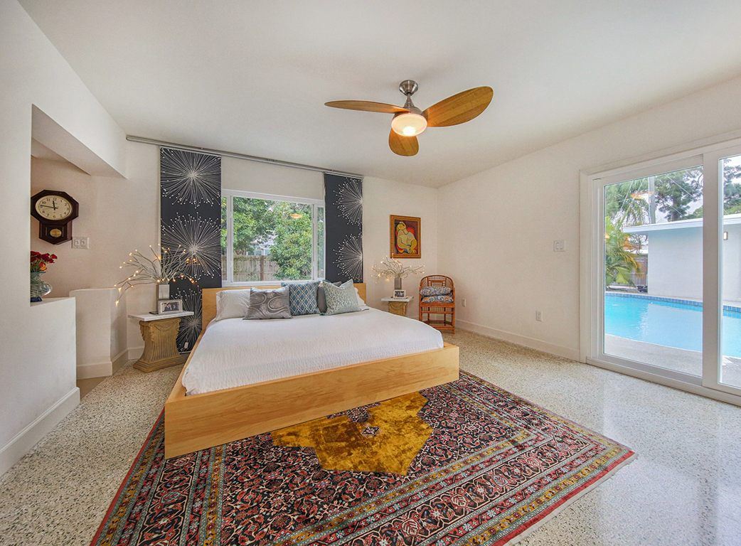 Main bedroom with a view of the pool